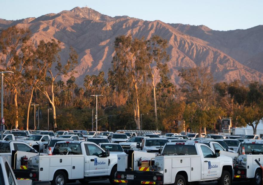 socalgas vehicles in a parking lot responding to the eaton fire